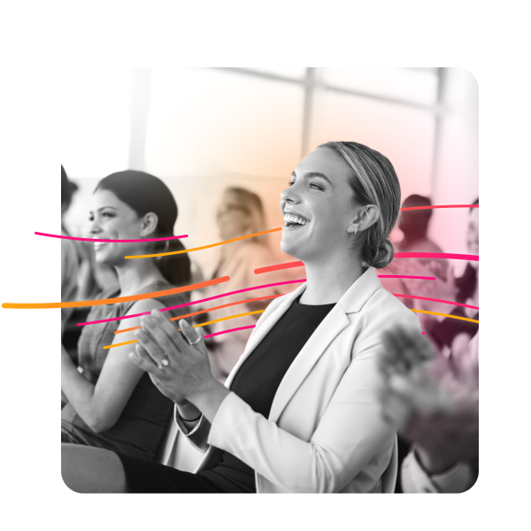 Close-up of audience members applauding a great presentation.